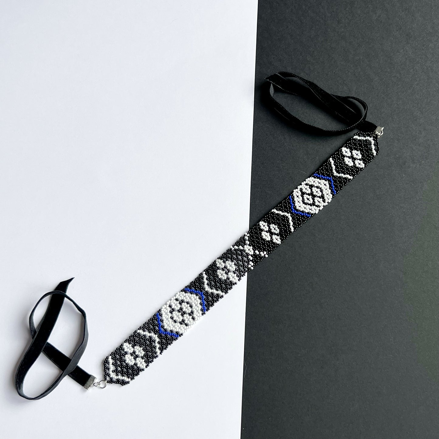 A Family Heirloom of the Kosach Family Gerdan Necklace with velvet clasp black and white beads with blue accents