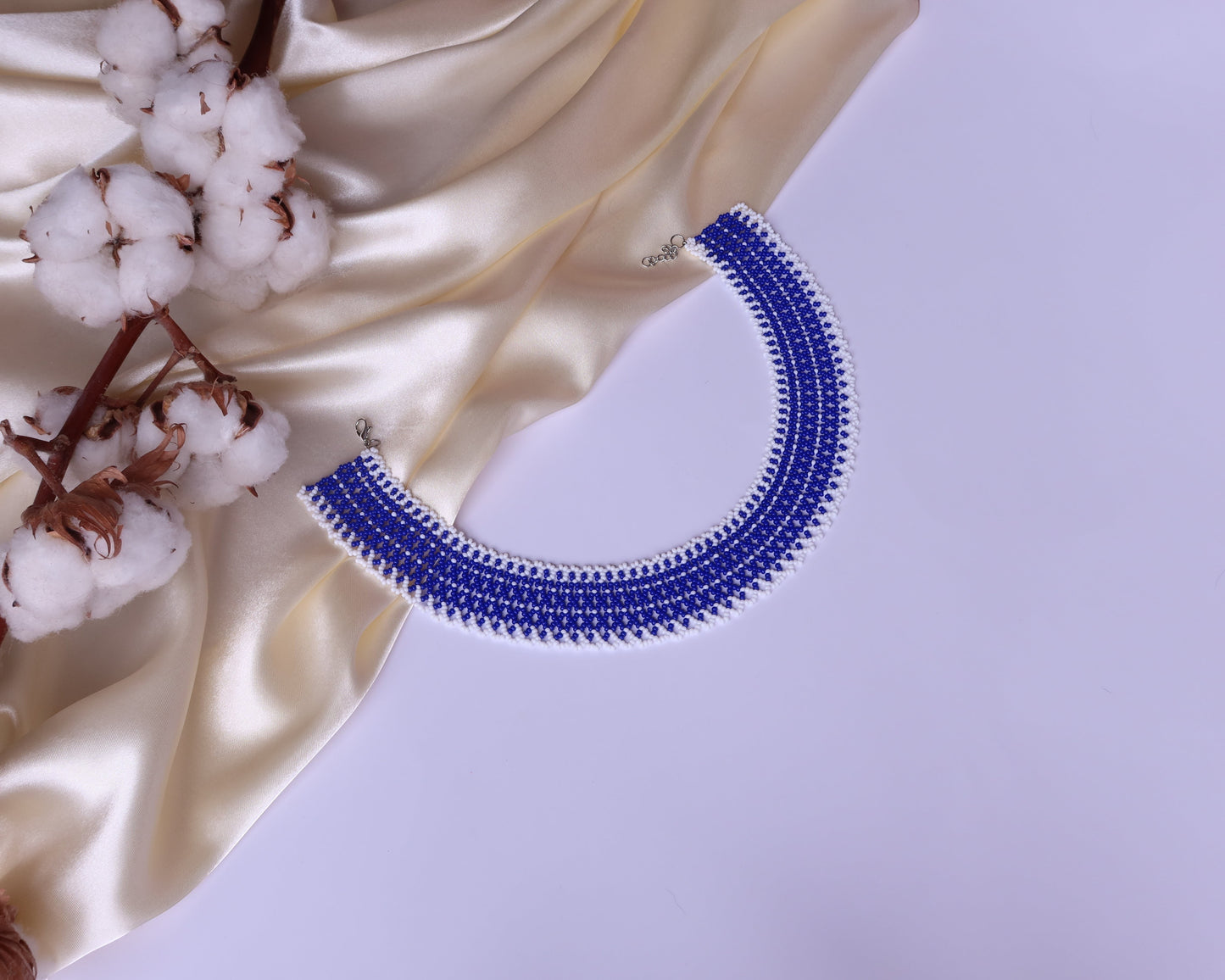 Comely UA blue and white beaded choker necklace with a linear pattern, made of Czech seed beads.