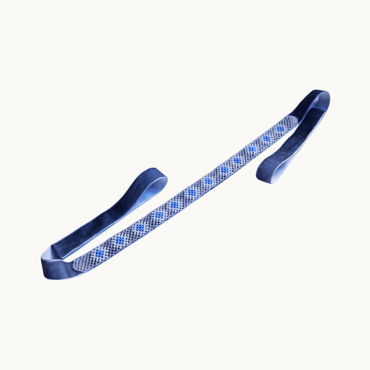 Pair of blue tongs with a textured pattern on a white background