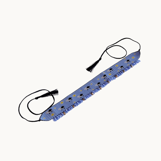 Blue LED strip with black connectors on a white background