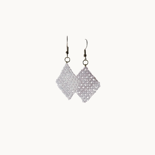 Pair of silver diamond-shaped earrings on a white background