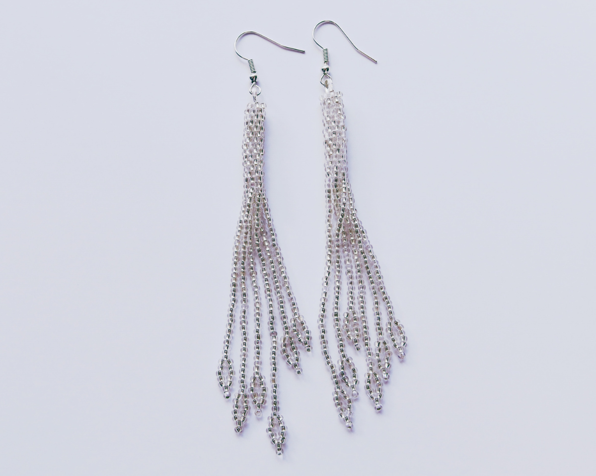 Silver chain earrings on a light gray background