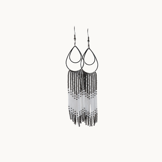 Black and white fringe earrings on a white background