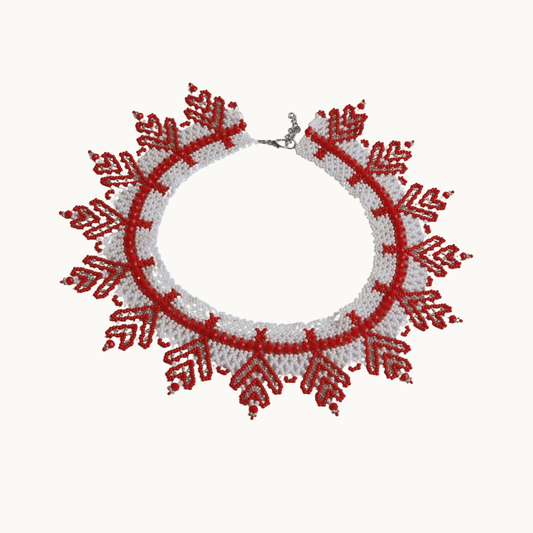 Necklace with red and white pattern on a white background