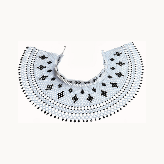 Decorative collar with black and white pattern on a white background