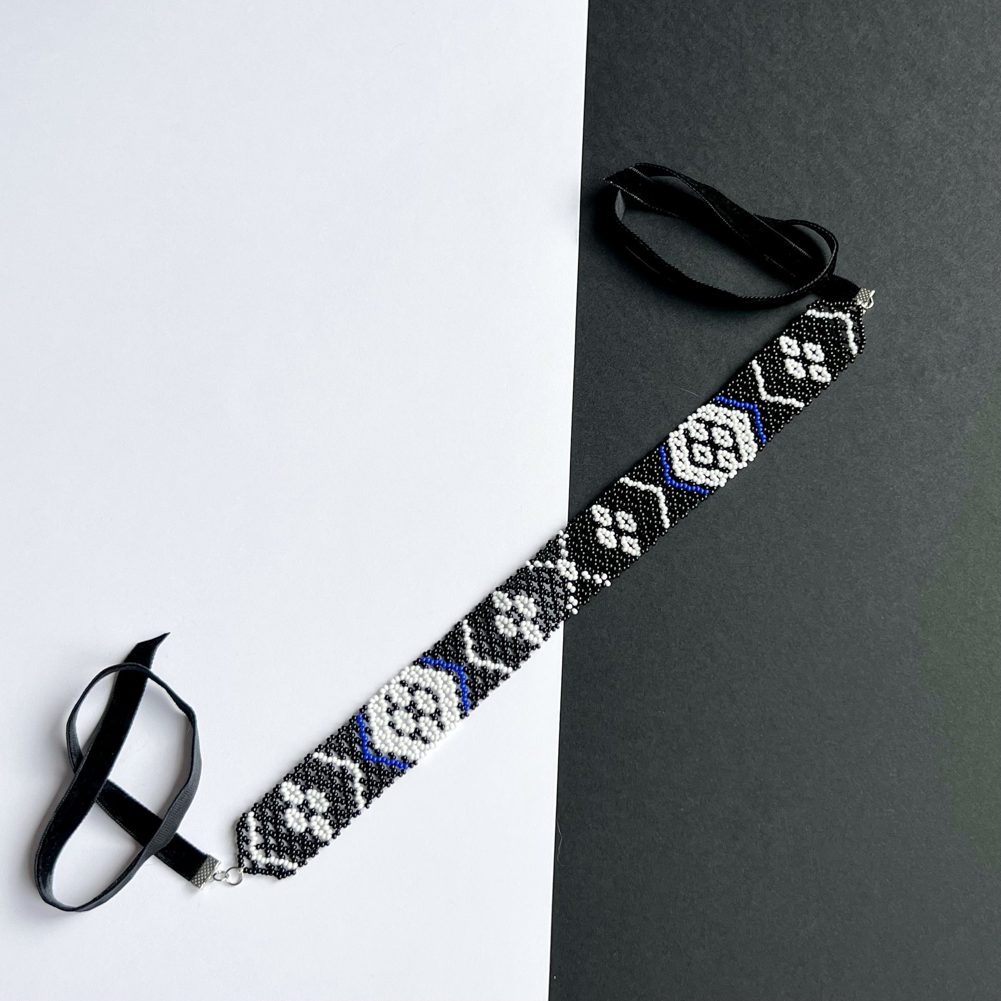 A Family Heirloom of the Kosach Family Gerdan Necklace with velvet clasp black and white beads with blue accents