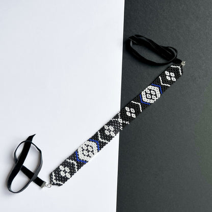 A Family Heirloom of the Kosach Family Gerdan Necklace with velvet clasp black and white beads with blue accents