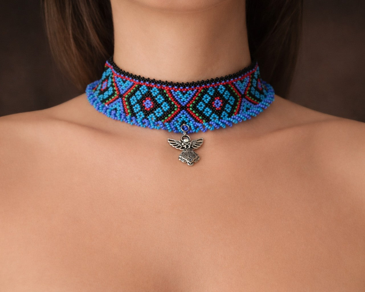 Comely UA blue, black, red, and green beaded choker with diamond pattern and angel pendant