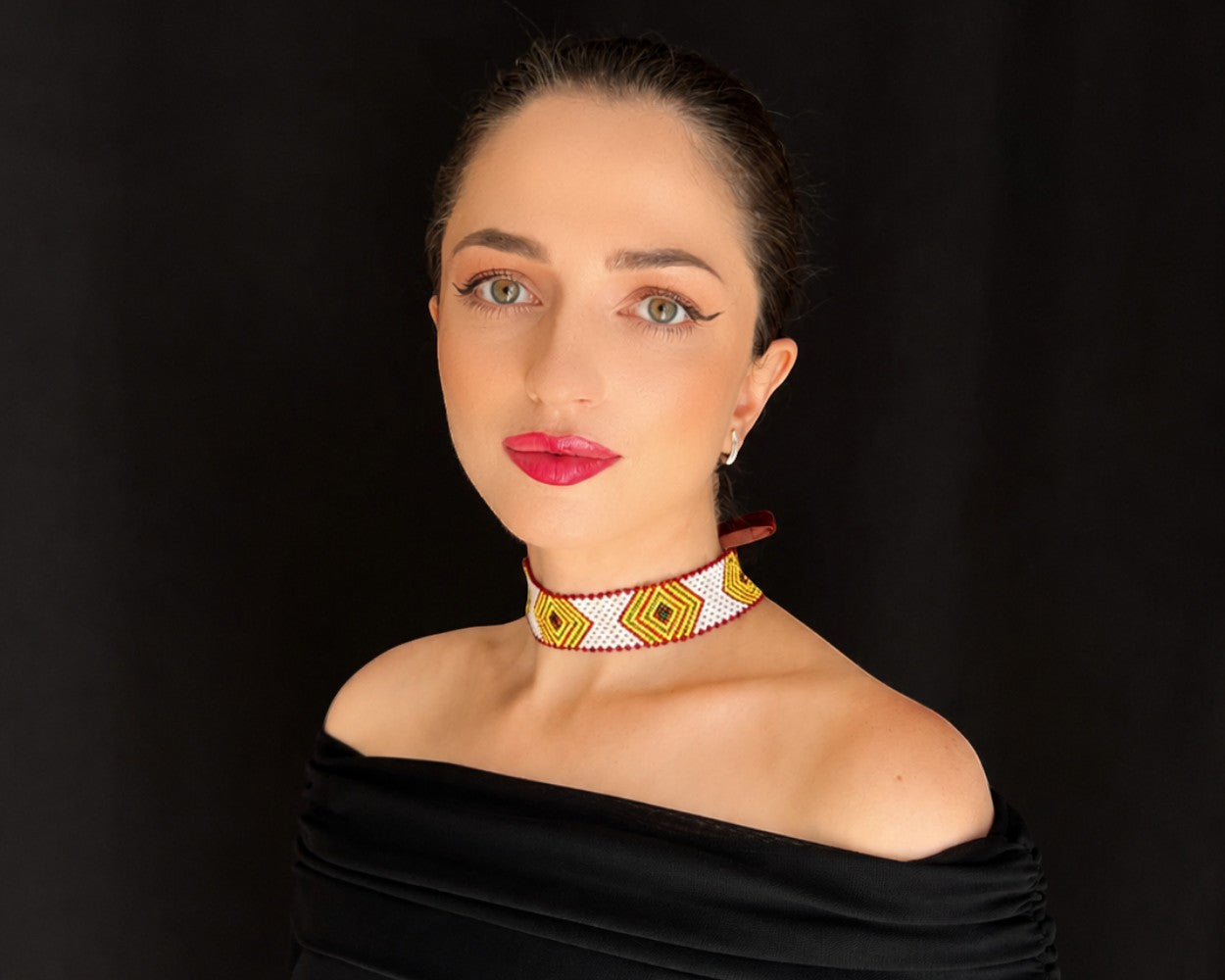Comely UA beaded choker necklace with yellow, green, and brown diamond pattern on a white background. Replica of Hutsul artistry.