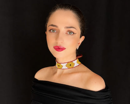 Comely UA beaded choker necklace with yellow, green, and brown diamond pattern on a white background. Replica of Hutsul artistry.