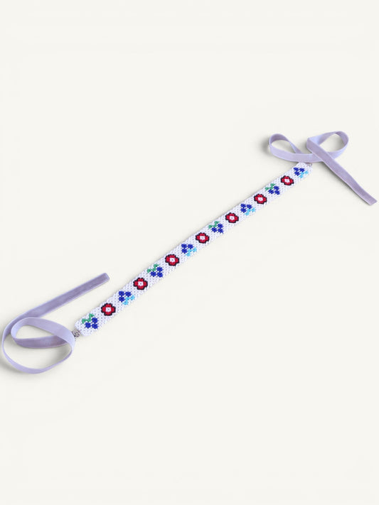 Comely UA white beaded gerdan necklace with red, blue, and green floral motifs and lavender velvet ribbons.