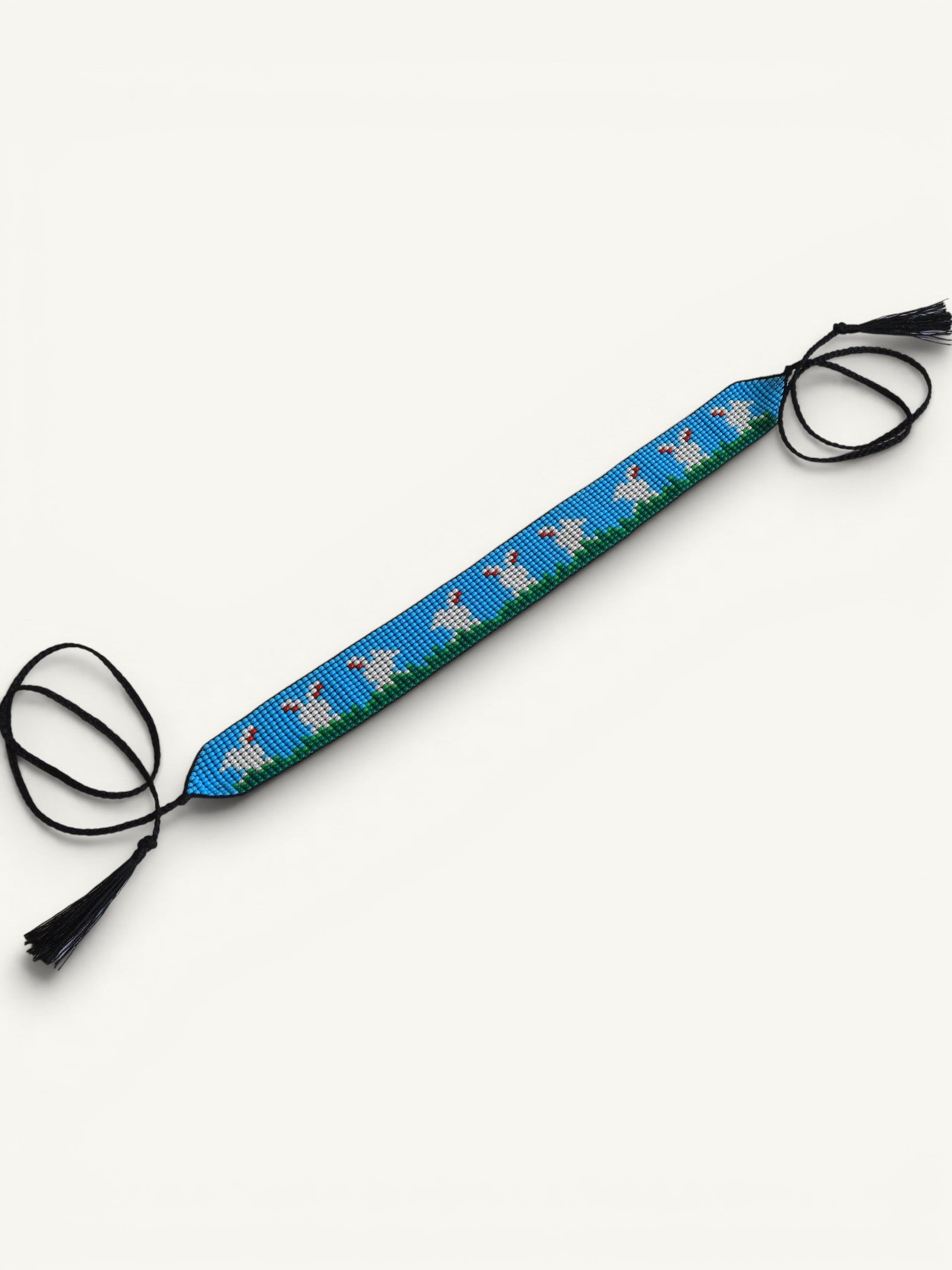 Comely UA beaded gerdan with white hares on blue sky and green grass, adjustable ties with tassels.