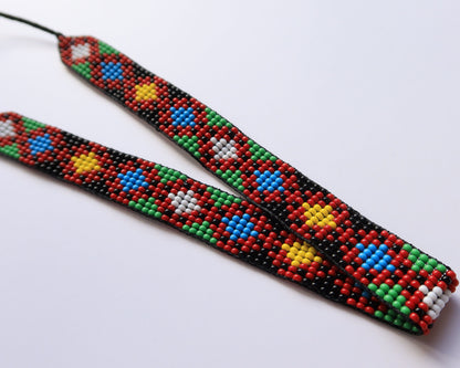 Comely UA beaded gerdan necklace with red, yellow, blue, green, and white diamond pattern on black background. Adjustable.