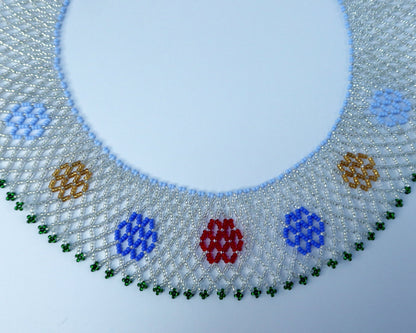 Comely UA beaded necklace with a mesh design, featuring red, blue, yellow, and green floral motifs. Replica of a historical Ukrainian silyanka.