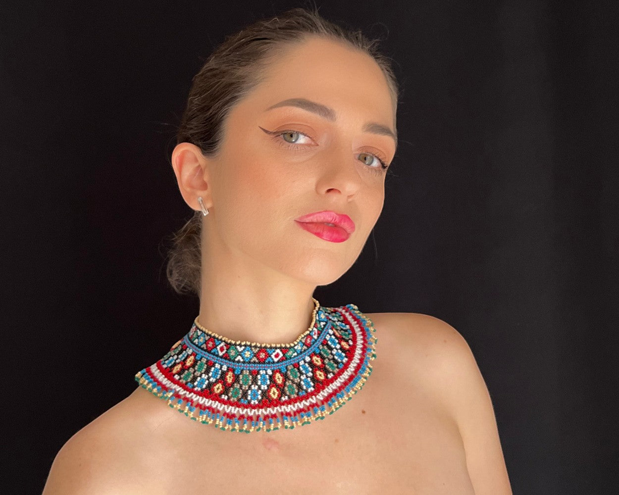 Comely UA two-part beaded necklace with red, blue, green, and white geometric patterns, gold accents.