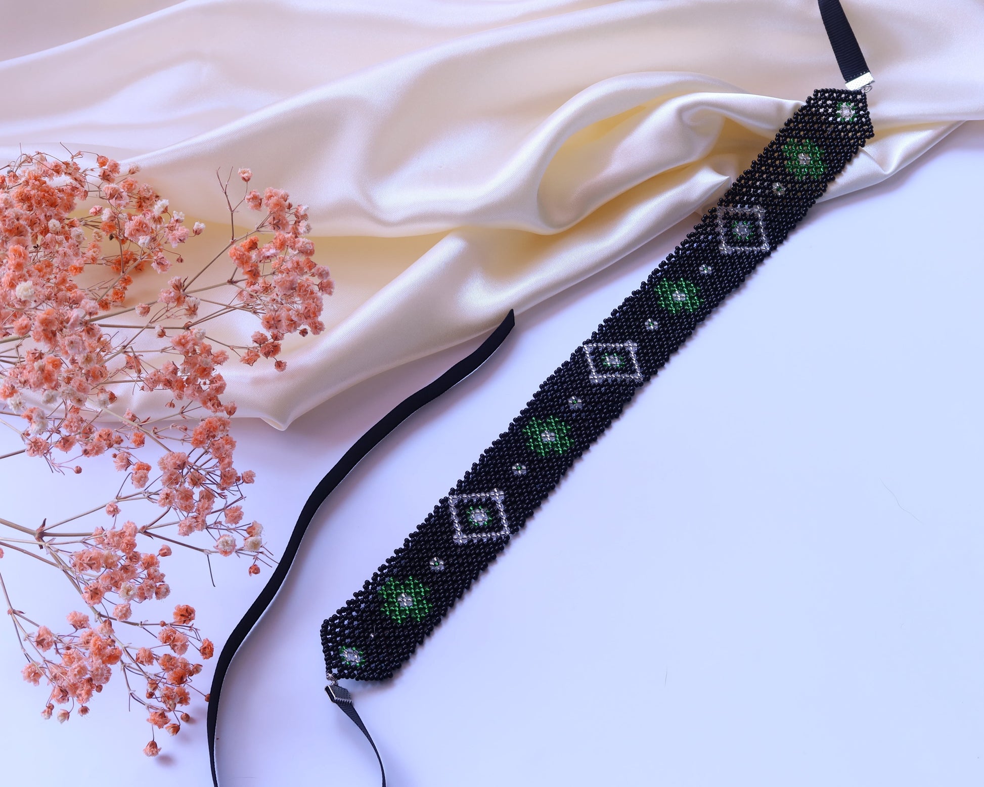Comely UA black beaded gerdan with green and white diamond pattern, 3cm wide, adjustable satin ribbons.