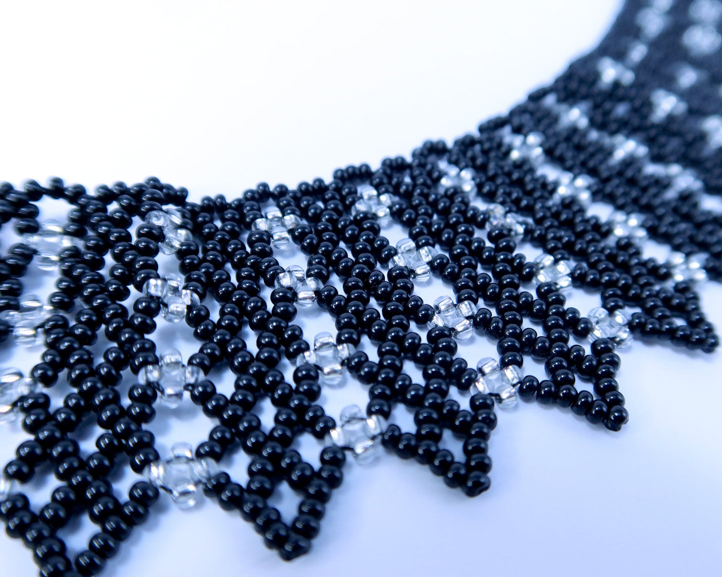 Comely UA black and silver beaded necklace with geometric pattern, inspired by Ukrainian design.