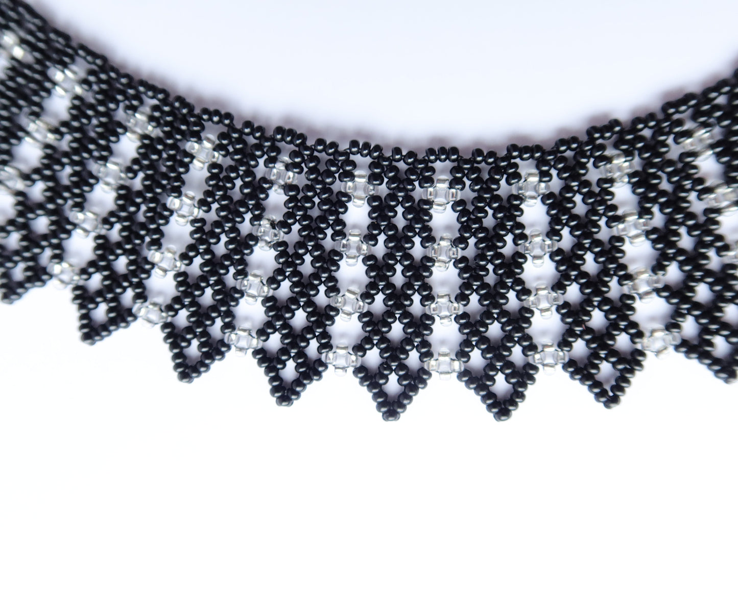Comely UA black and silver beaded necklace with geometric pattern, inspired by Ukrainian design.