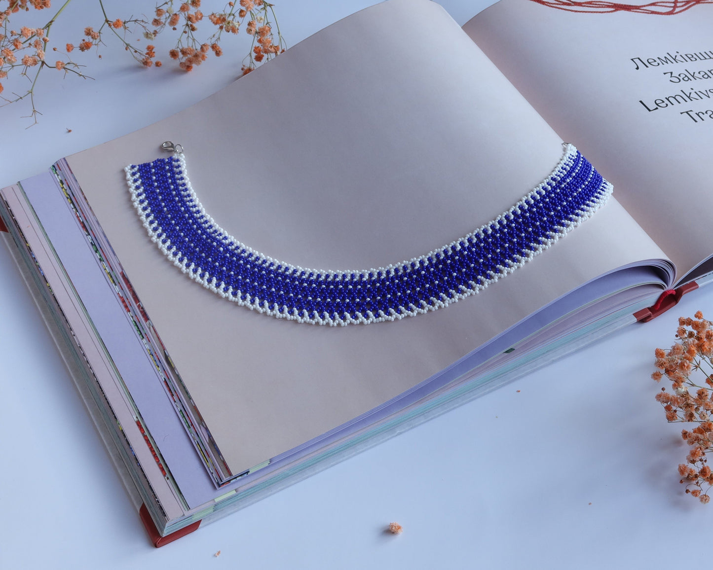 Comely UA blue and white beaded Silyanka necklace with intricate linear pattern, made of Czech seed beads.