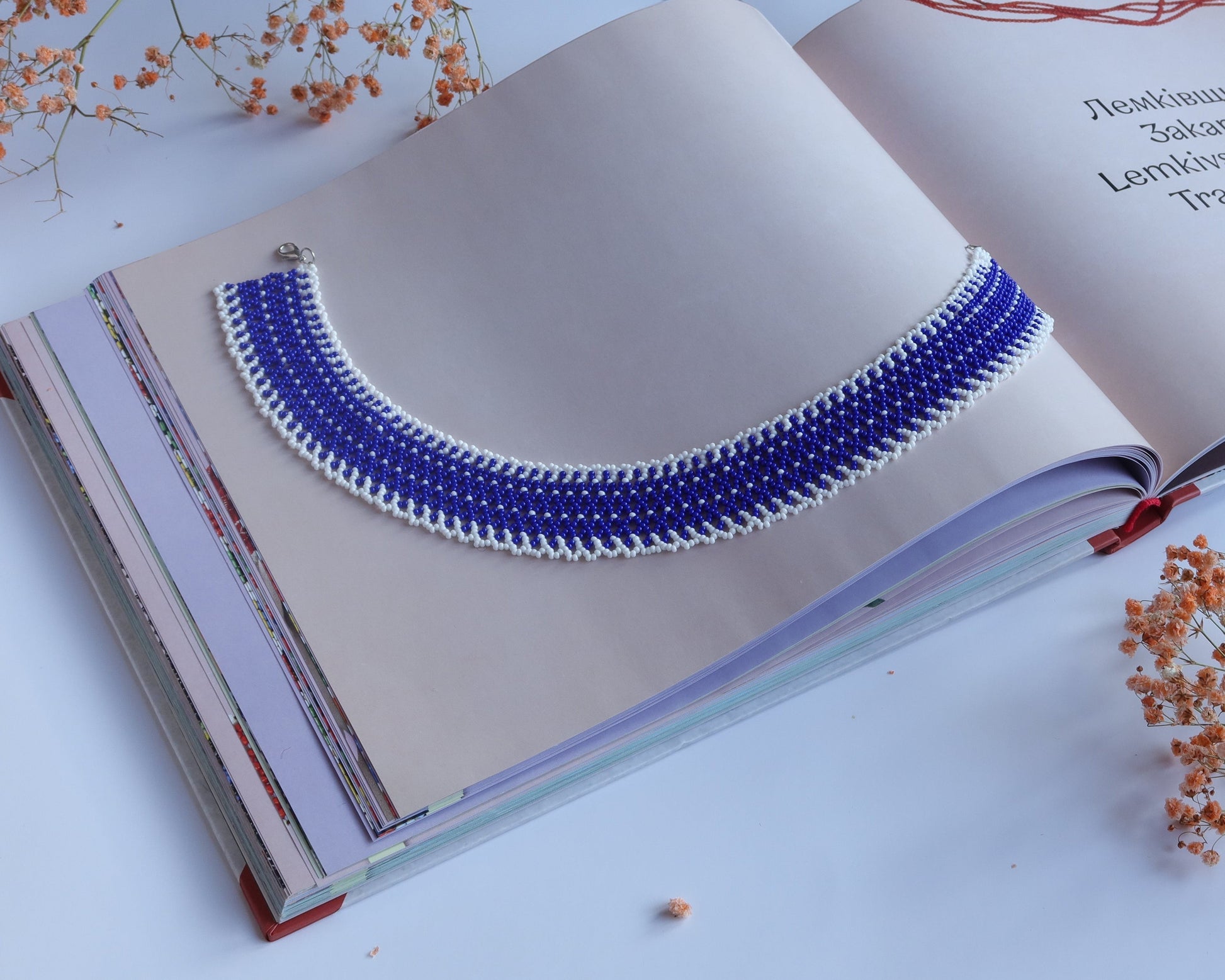 Comely UA blue and white beaded Silyanka necklace with intricate linear pattern, made of Czech seed beads.