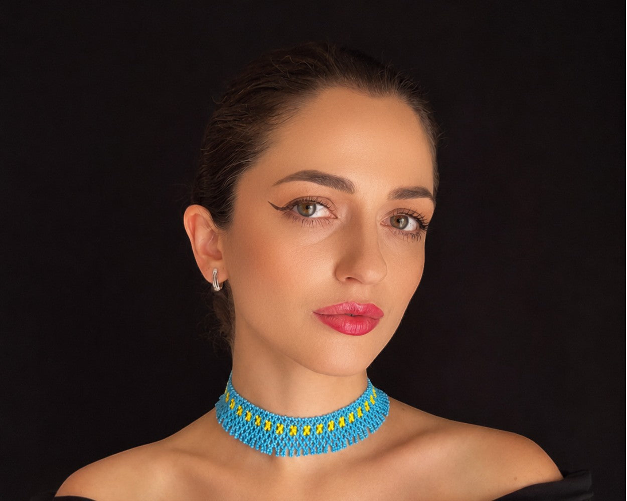 Comely UA blue and yellow beaded choker necklace with geometric seed bead pattern, inspired by Pokuttian traditions.