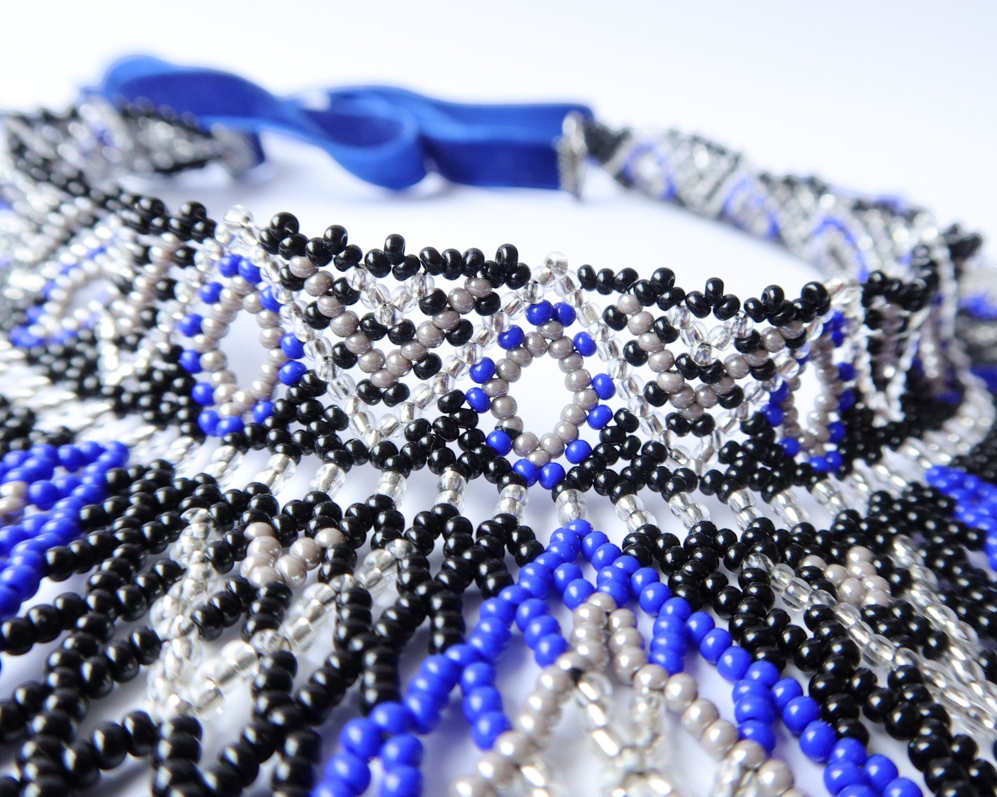 Comely UA Evian beaded necklace with blue, black, and silver Czech seed beads and velvet ribbon ties. Diamond pattern.