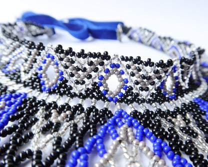 Comely UA Evian beaded necklace with blue, black, and silver Czech seed beads and velvet ribbon ties. Diamond pattern.
