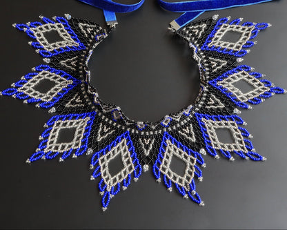 Comely UA Evian beaded necklace with blue, black, and silver diamond patterns and velvet ribbon ties.
