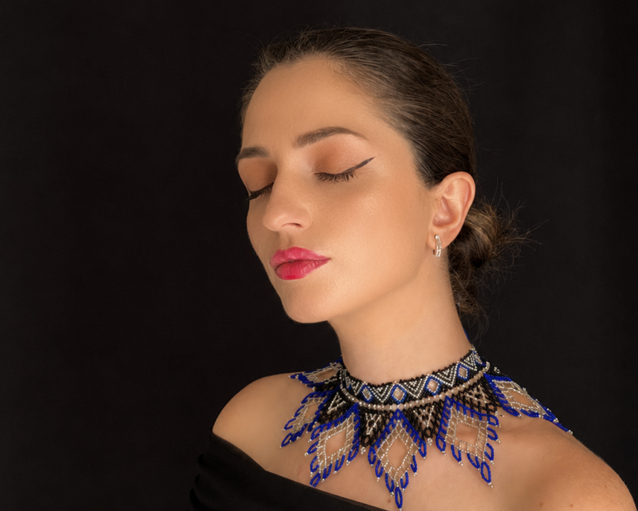 Comely UA Evian beaded necklace with blue, silver, and black diamond pattern. Czech seed beads and velvet ribbon ties.