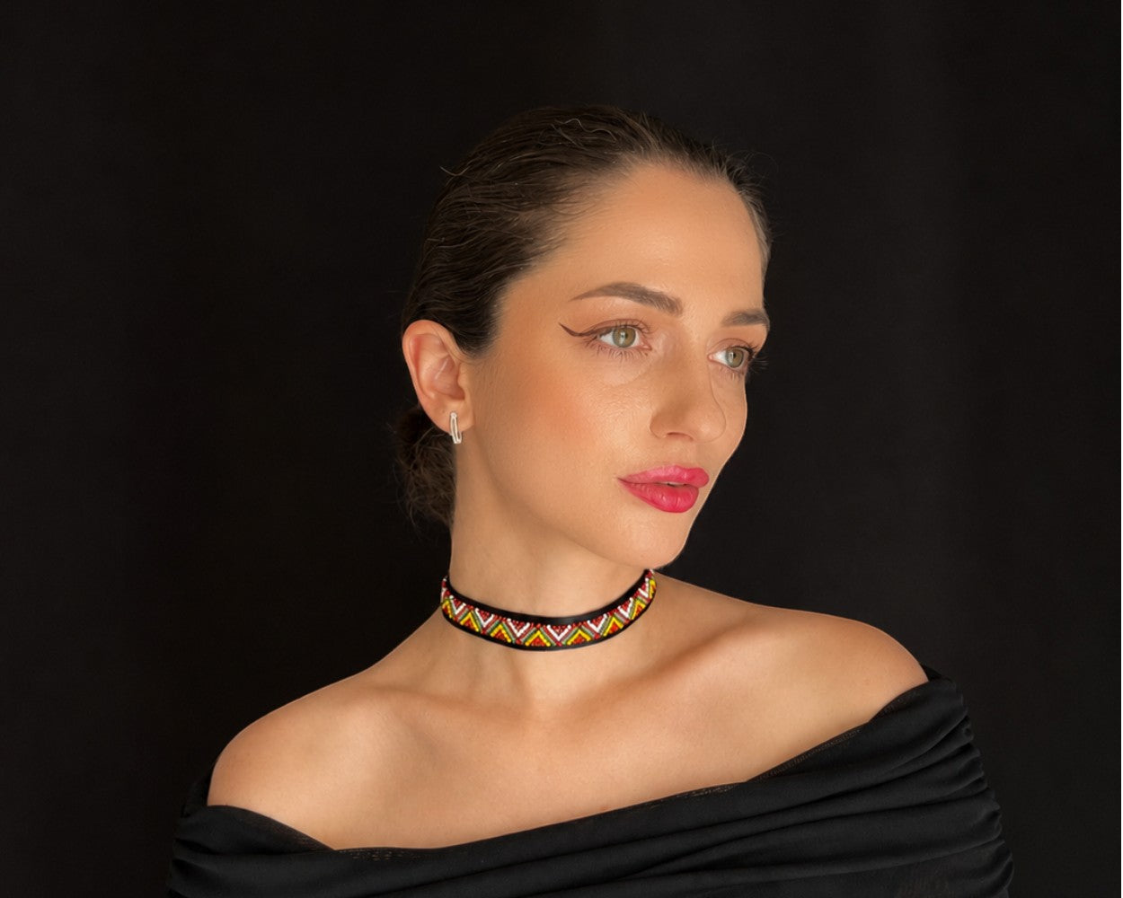 Comely UA Gerdan Three Fires beaded choker with red, yellow, and green diamond motif on black satin ribbon.