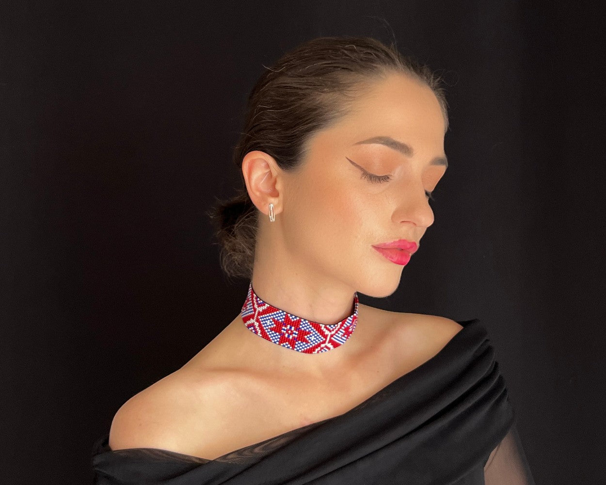 Comely UA Gerdan Donechchyna beaded choker necklace with red, white, and blue geometric pattern. Adjustable ties.