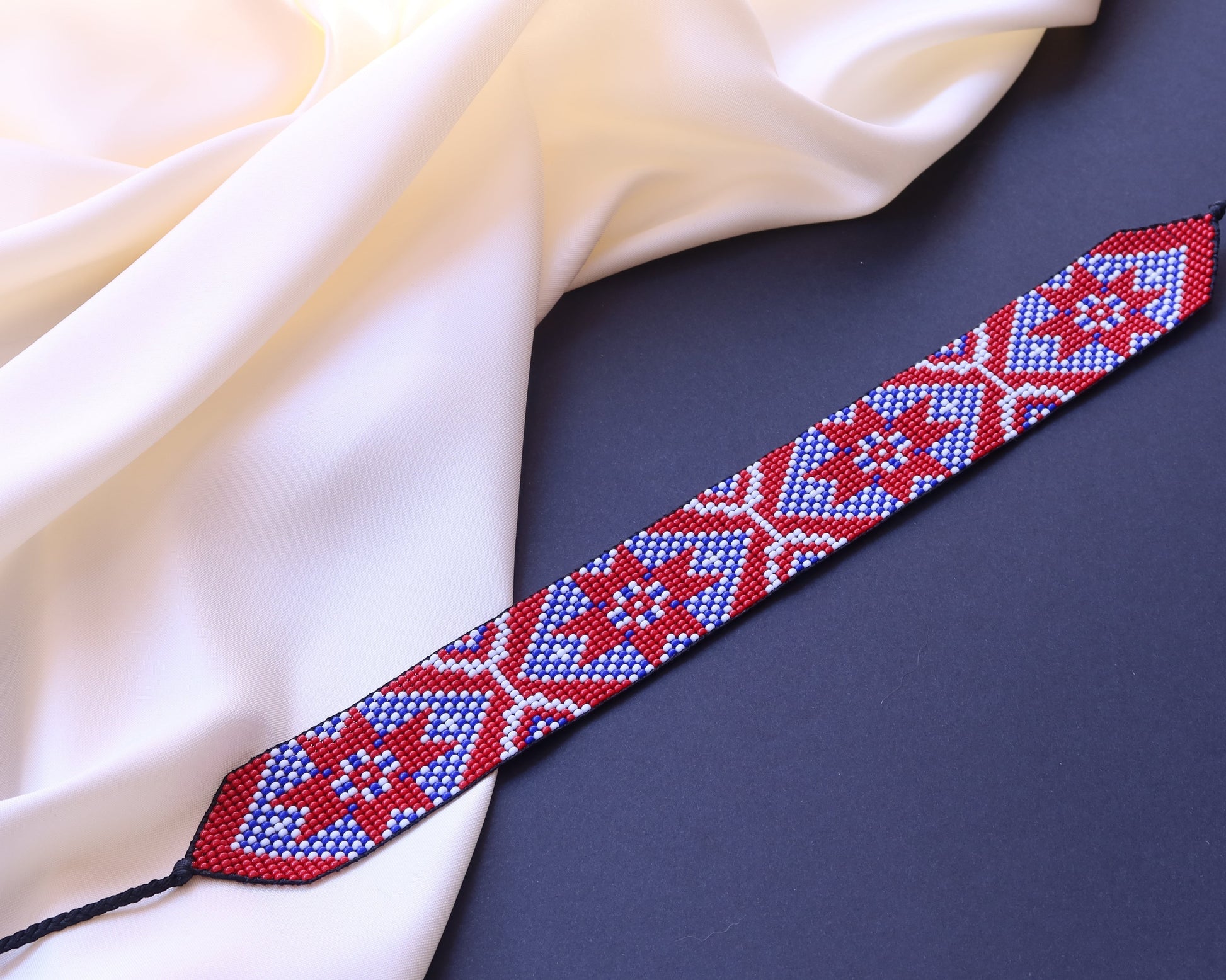 Comely UA Gerdan "Donechchyna" beaded choker with red, blue, and white geometric pattern. Adjustable ties.