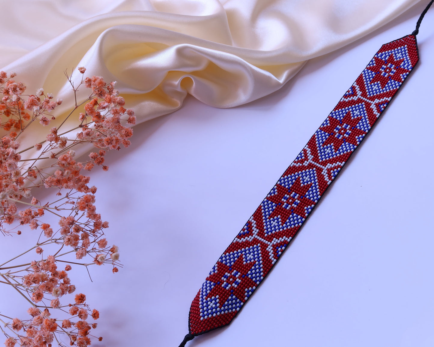 Comely UA Gerdan "Donechchyna" beaded necklace with red, blue, and white geometric pattern. Adjustable ties.