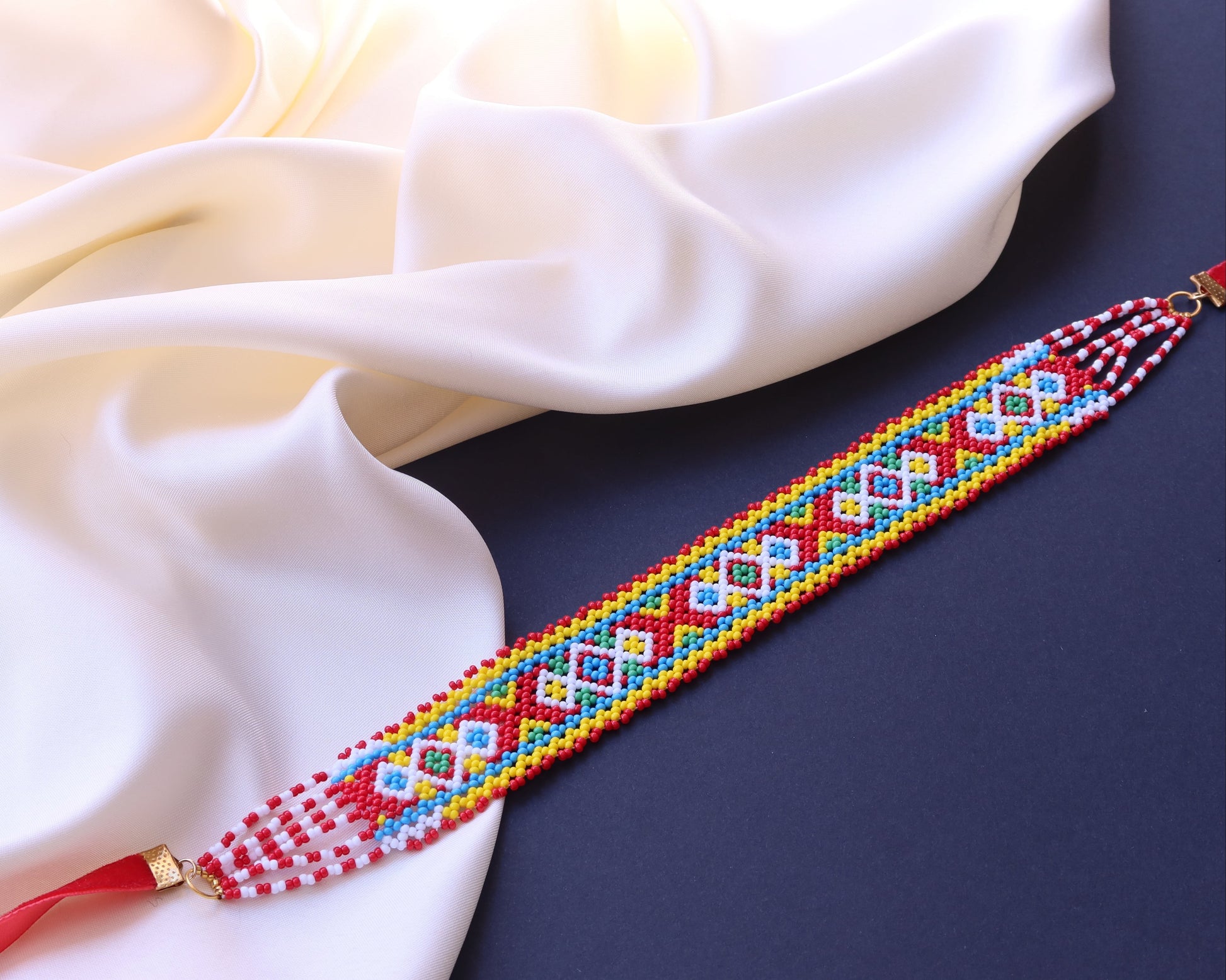 Comely UA Gerdan Khust Ornament beaded choker with red, yellow, blue, and white geometric patterns. Adjustable clasp.
