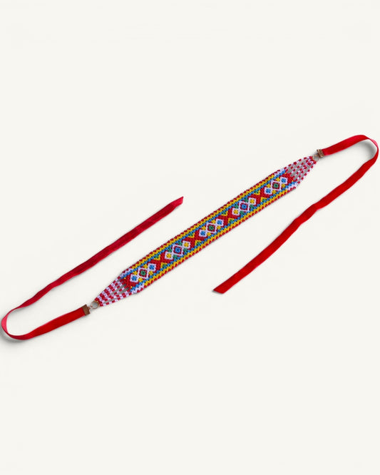 Comely UA Gerdan Khust Ornament beaded choker with red ribbon ties, featuring geometric diamond pattern in red, yellow, blue, and white.