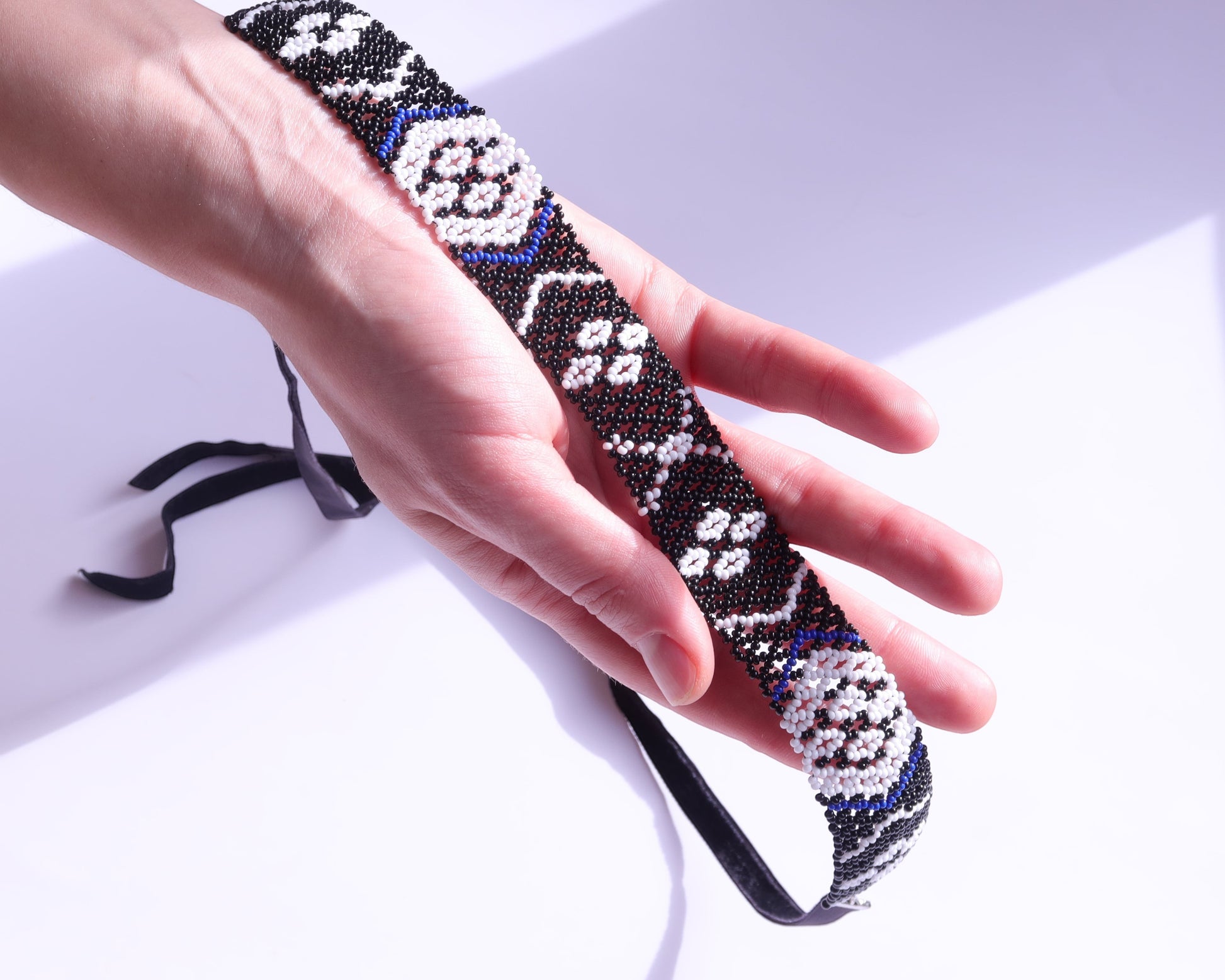 Comely UA Gerdan Kosach beaded necklace with black, white, and blue seed beads, featuring traditional Ukrainian diamond pattern. Replica of Lesia Ukrainka's necklace.