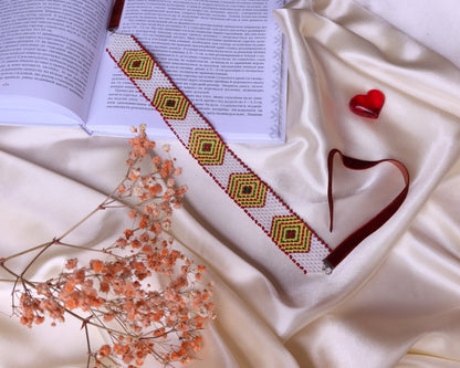 Comely UA beaded gerdan necklace with white, yellow, green, and brown diamond pattern. Czech seed beads, nylon thread, velvet ribbons.