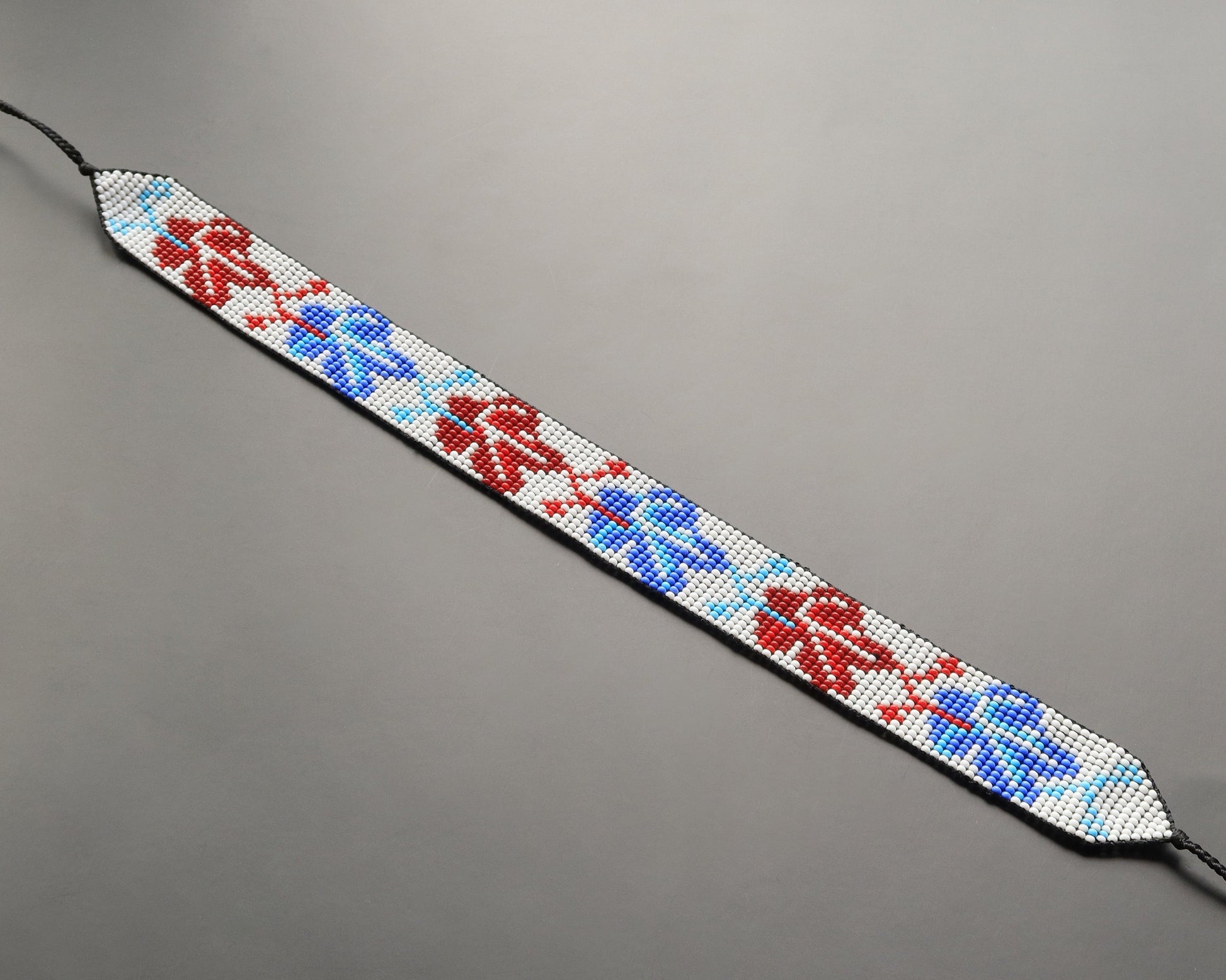 Comely UA beaded gerdan necklace with red, blue, and white leaf pattern. Czech seed beads.