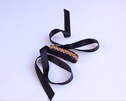 Comely UA Gerdan Three Fires beaded ribbon necklace with red, yellow, green diamond motif on black satin ribbon.
