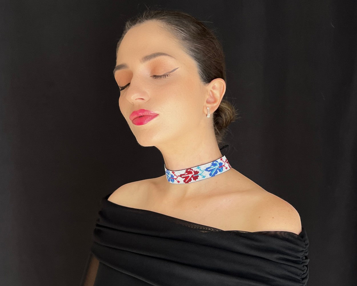 Comely UA beaded gerdan necklace with blue and red leaf pattern on white background. Czech seed beads.