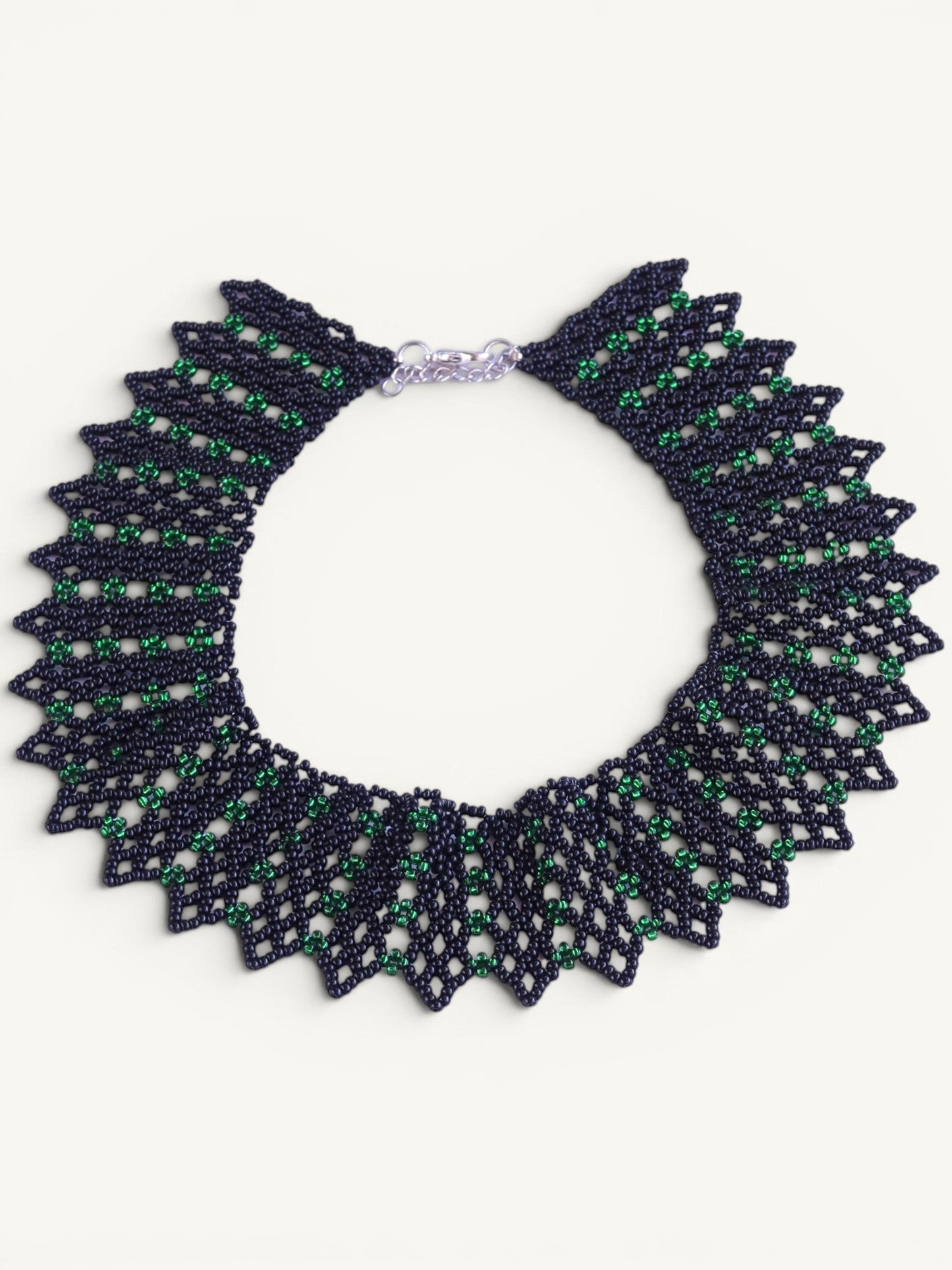 Comely UA green and dark blue beaded necklace with geometric pattern and adjustable clasp. Inspired by Ukrainian design.