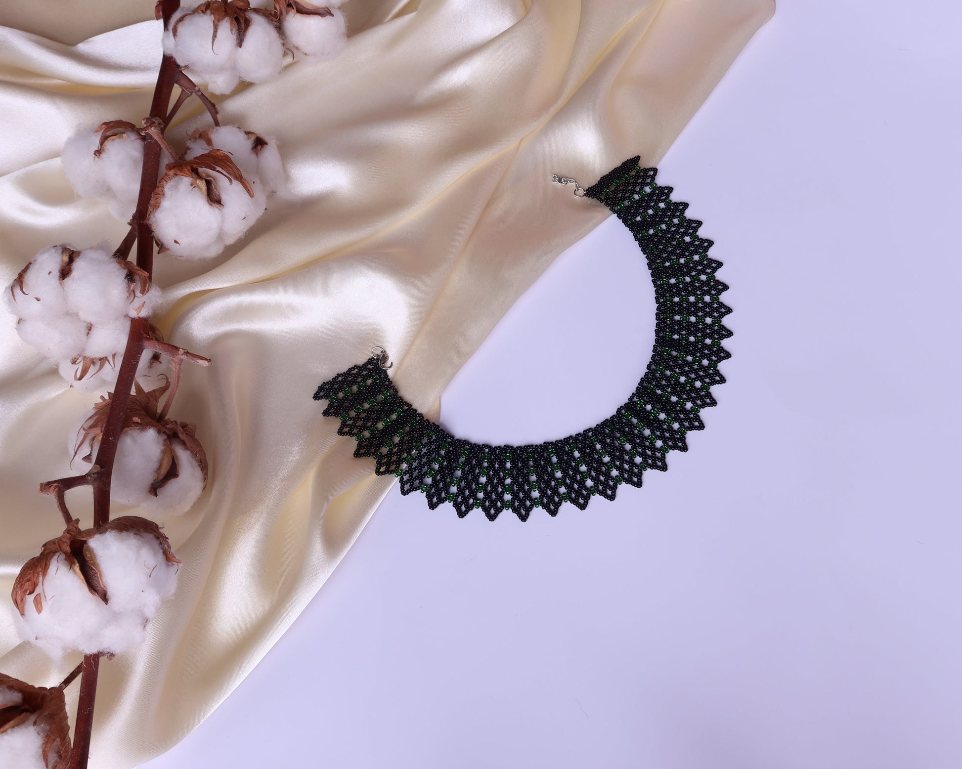 Comely UA green and black beaded necklace with geometric pattern, inspired by Ukrainian design. Czech seed beads.