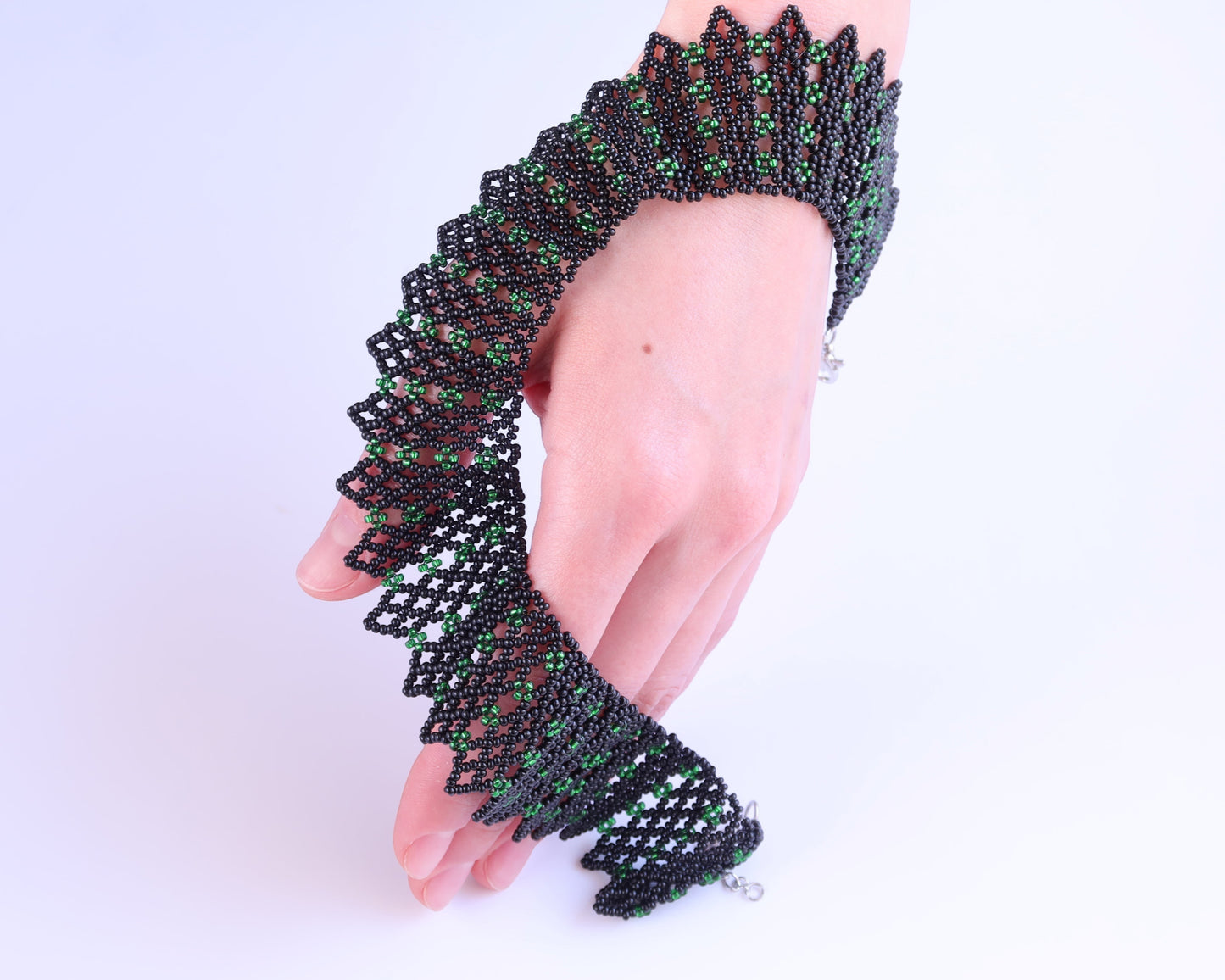 Comely UA green and black beaded necklace with geometric pattern, inspired by Ukrainian traditions.