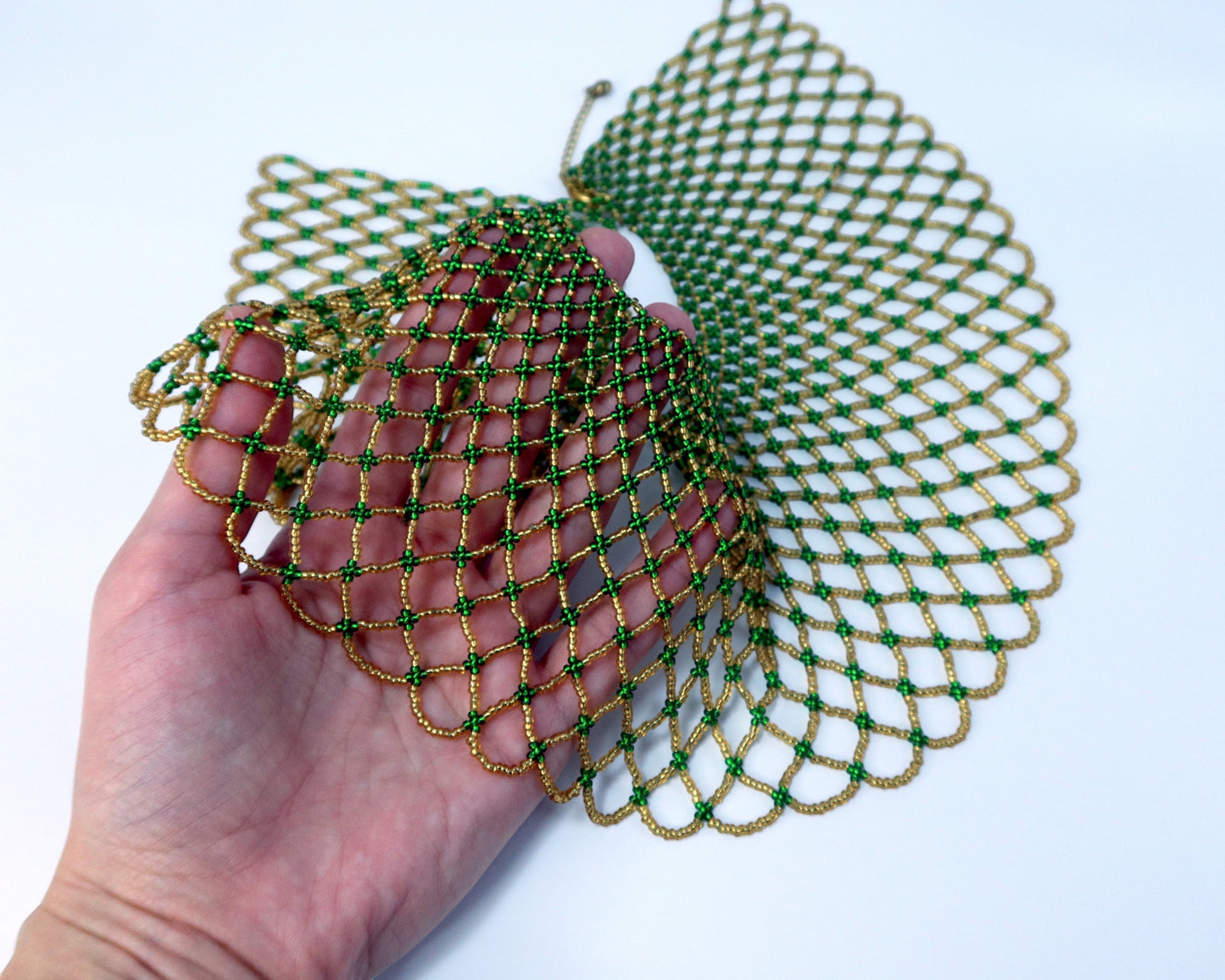 Comely UA Kupava beaded collar in green and gold Czech seed beads, featuring an open net design and adjustable clasp.