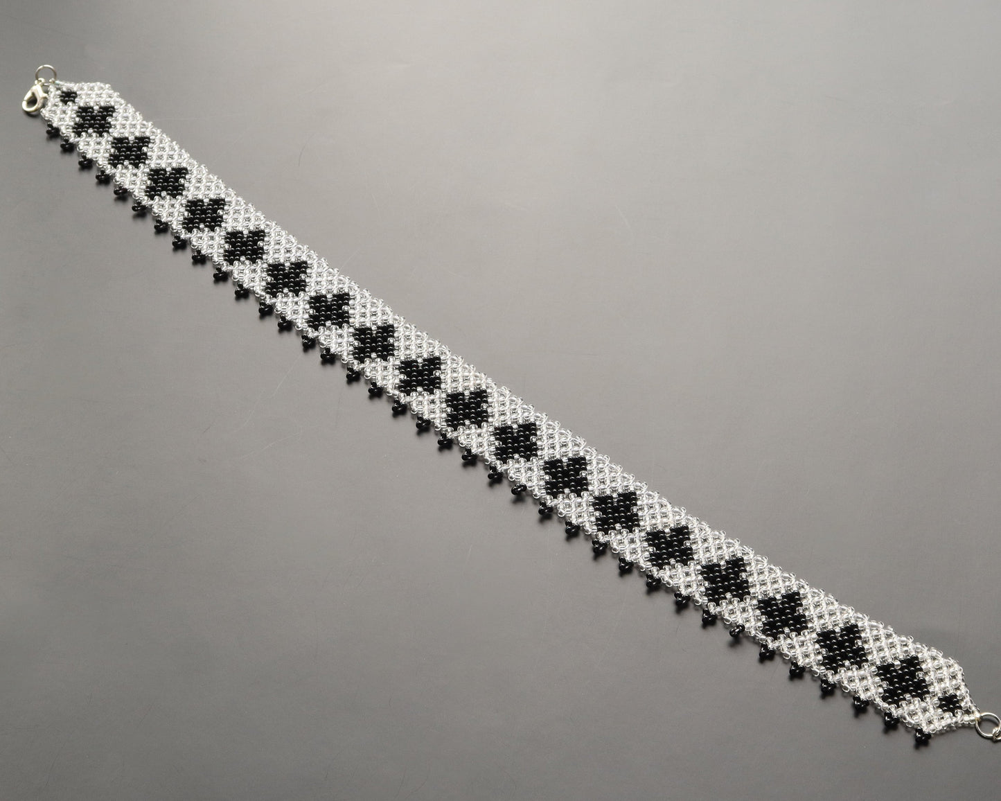 Comely UA "Ladana" black and clear beaded gerdan with cross pattern and fringed edge. Czech seed beads.