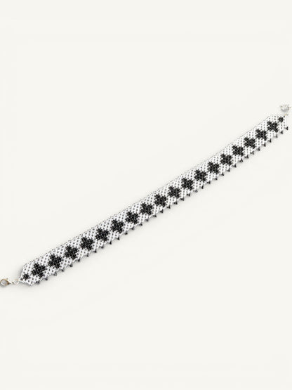 Comely UA "Ladana" black and clear beaded gerdan necklace with cross pattern and fringed edge.