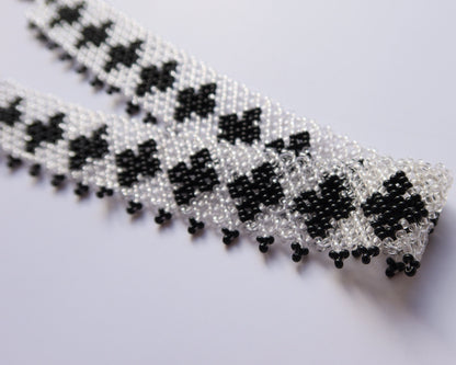 Comely UA "Ladana" gerdan necklace with black cross pattern on transparent Czech seed beads, fringed edge.
