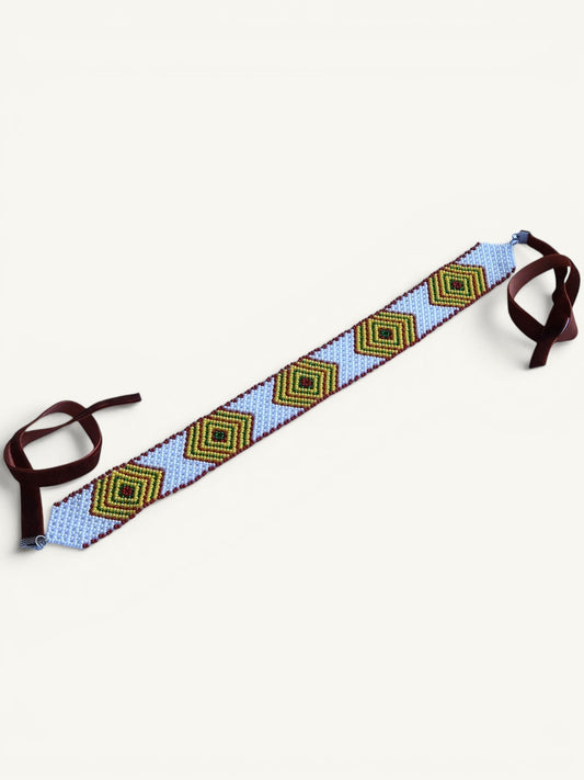 Comely UA beaded gerdan necklace with blue background, diamond pattern in green, yellow, and brown, with velvet ribbons.