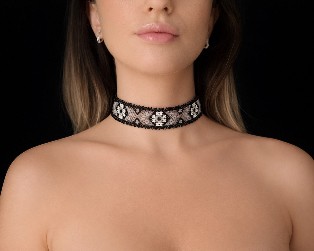 Comely UA Mistweaver beaded gerdan necklace with black, milk, and clear glass beads in a traditional Hutsul geometric pattern.