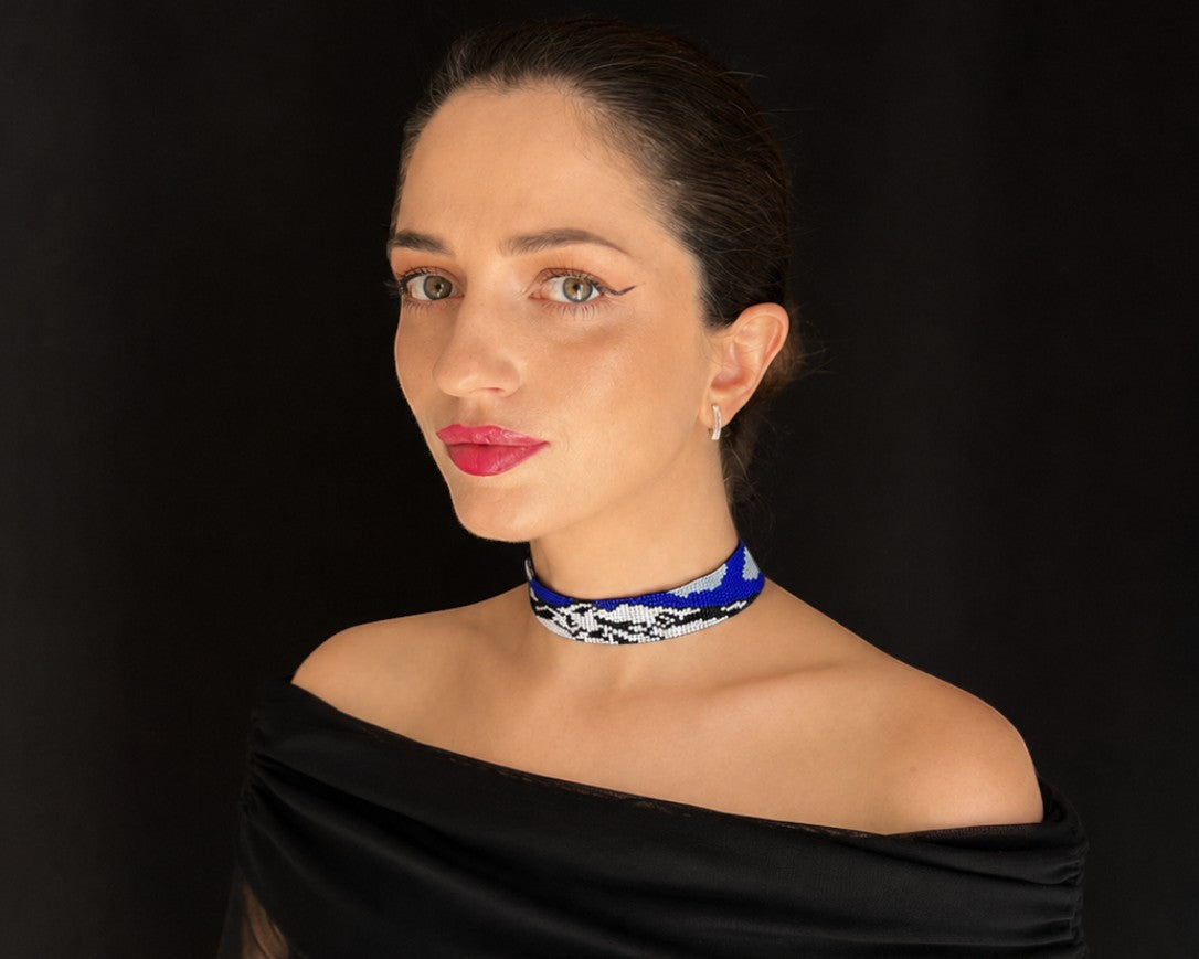 Comely UA Mont Blanc beaded choker necklace in blue, white, and black with adjustable ties and tassels.